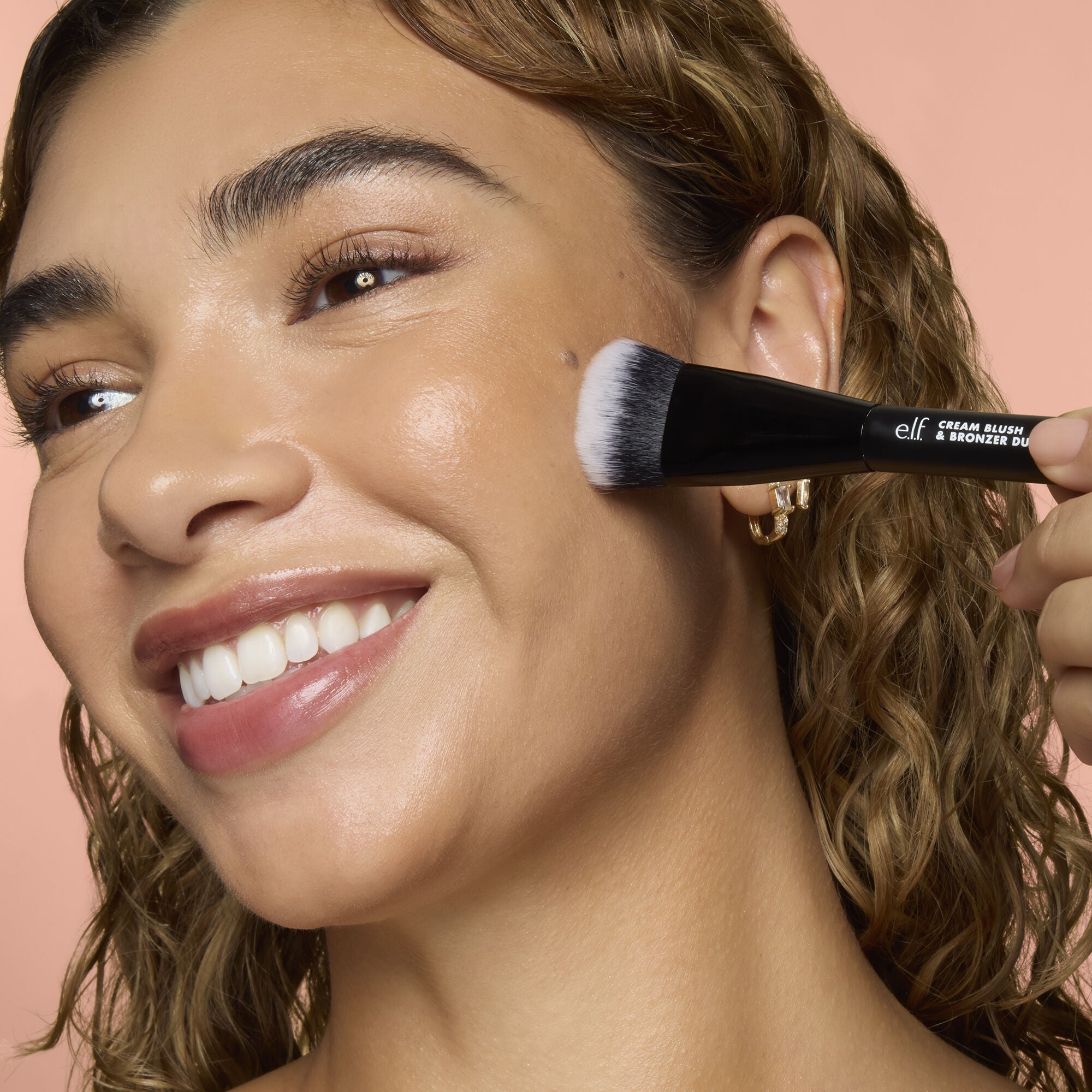 Model Applying Makeup Using the Cream Blush and Bronzer Duo Makeup Brush