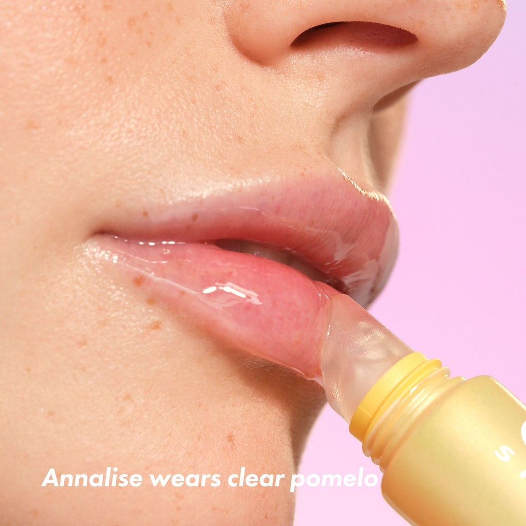Woman Applying Thirst Burst Clear Pomelo Lip Treatment